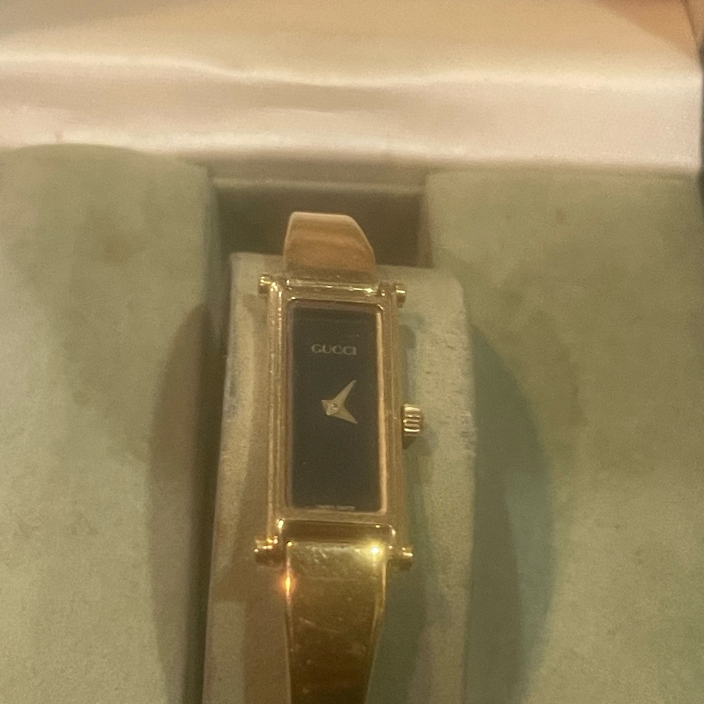 Authentic Vintage Gucci watch some signs of wear, but still in good condition.